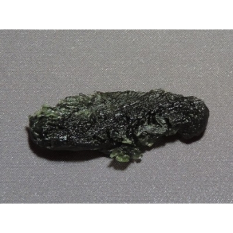 Tektite, so-called Chinese Moldavite, rare. About 14.7 million years old