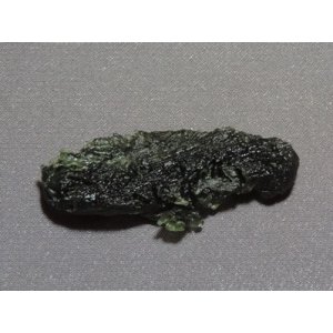 Tektite, so-called Chinese Moldavite, rare. About 14.7 million years old