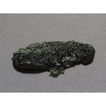 Tektite, so-called Chinese Moldavite, rare. About 14.7 million years old